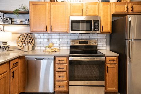 Kitchen with Stainless Steel Appliances at Grand Island Apartments in Memphis TN 38103